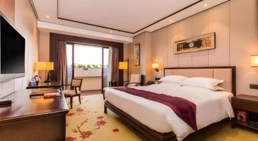 Bed in Xiang Yun Sha Garden Hotel