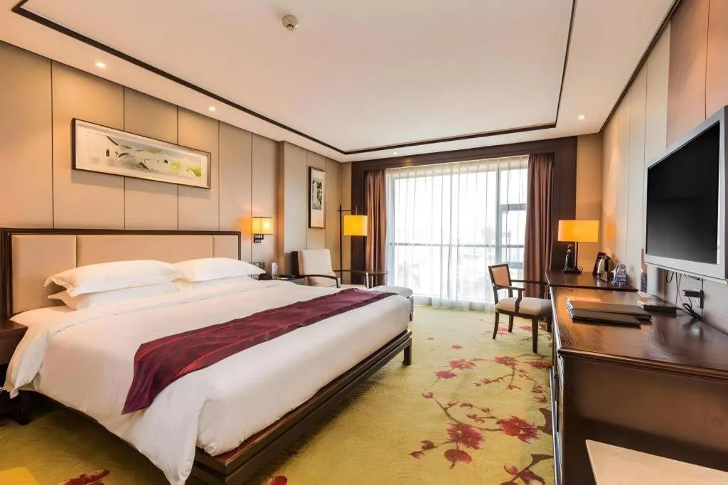 Bed in Xiang Yun Sha Garden Hotel