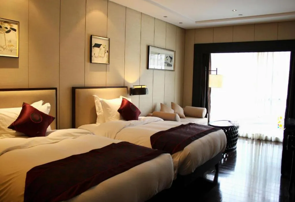 Bed in Xiang Yun Sha Garden Hotel