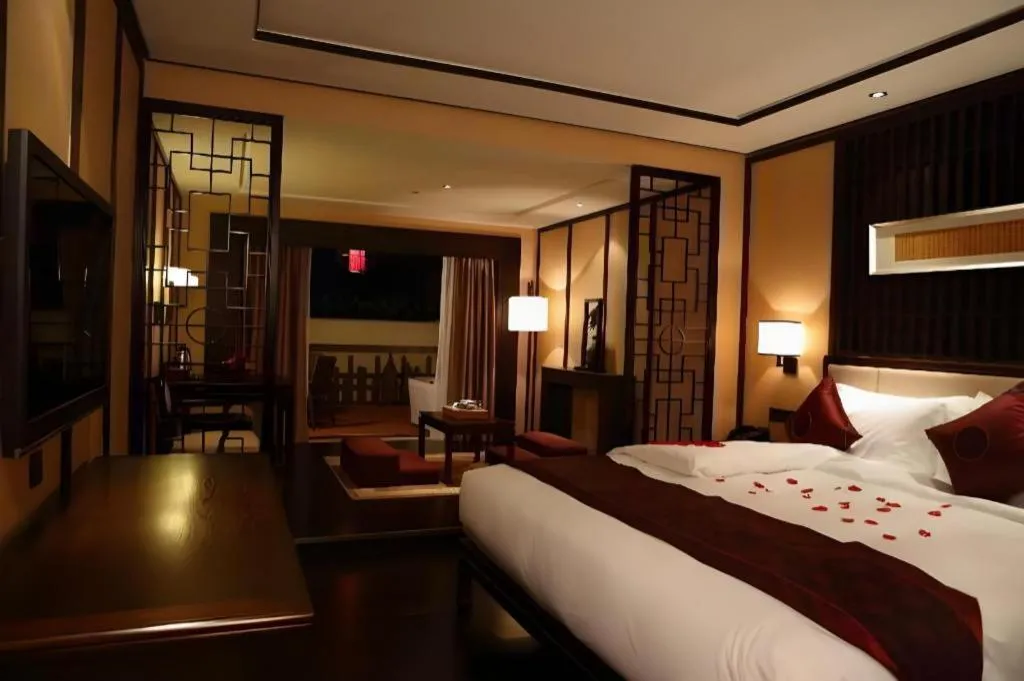 Bed in Xiang Yun Sha Garden Hotel