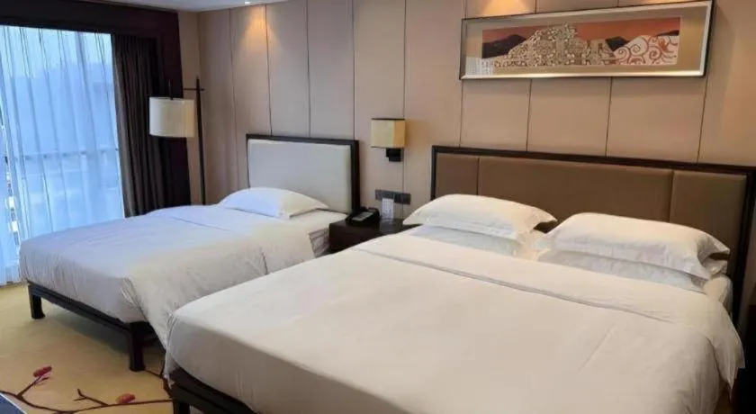 Bed in Xiang Yun Sha Garden Hotel