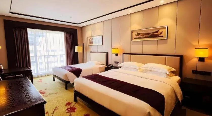 Bed in Xiang Yun Sha Garden Hotel