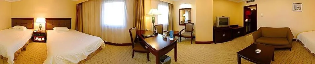 Bed in AC Embassy Hotel