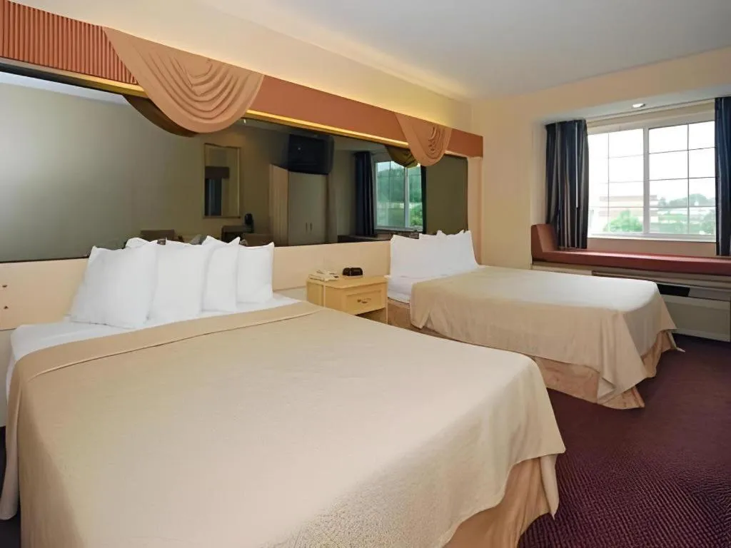 Bed in Quality Inn & Suites