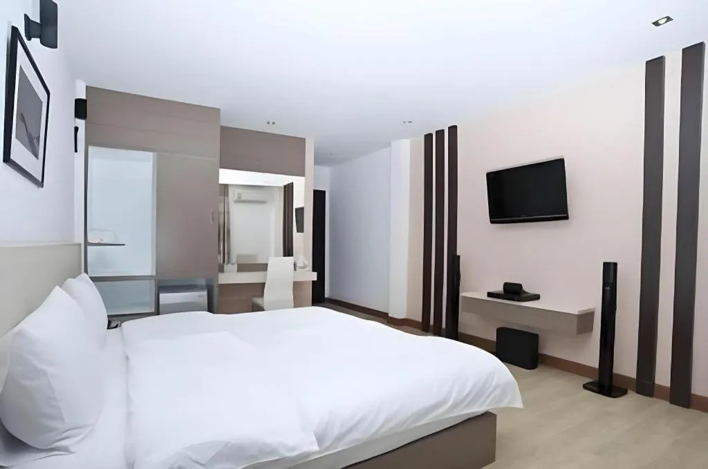 Bed in Siamgrand Hotel