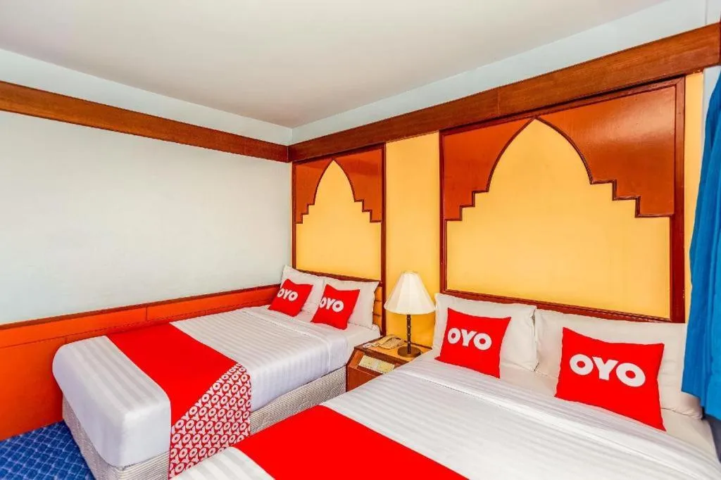 Bed in OYO 441 Grand Thara Hotel