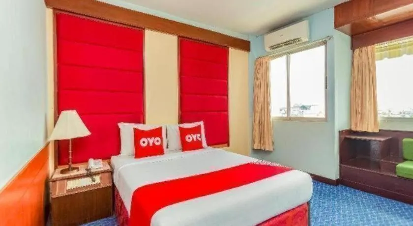 Bed in OYO 441 Grand Thara Hotel