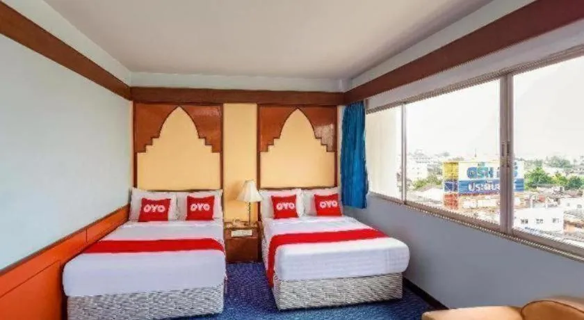 Bed in OYO 441 Grand Thara Hotel