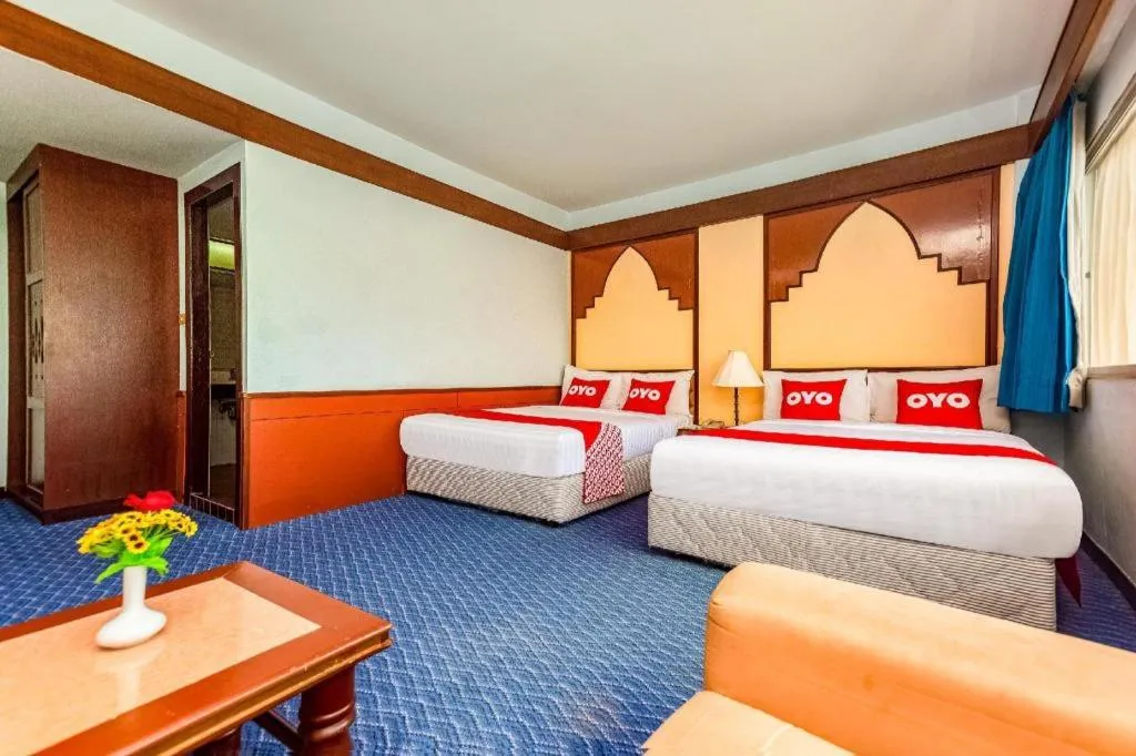 Bed in OYO 441 Grand Thara Hotel