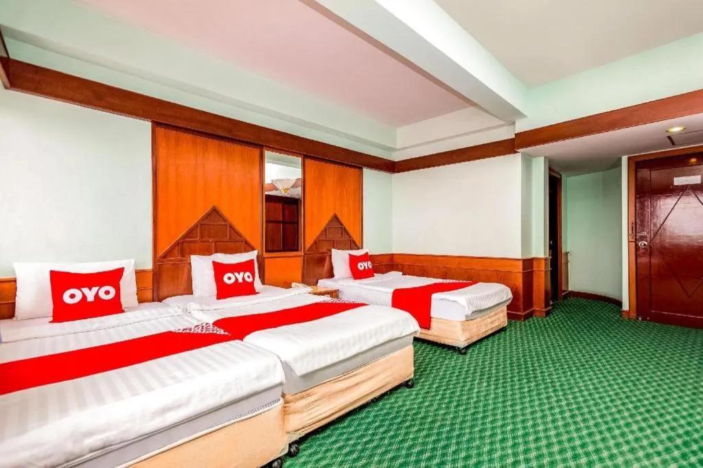 Bed in OYO 441 Grand Thara Hotel