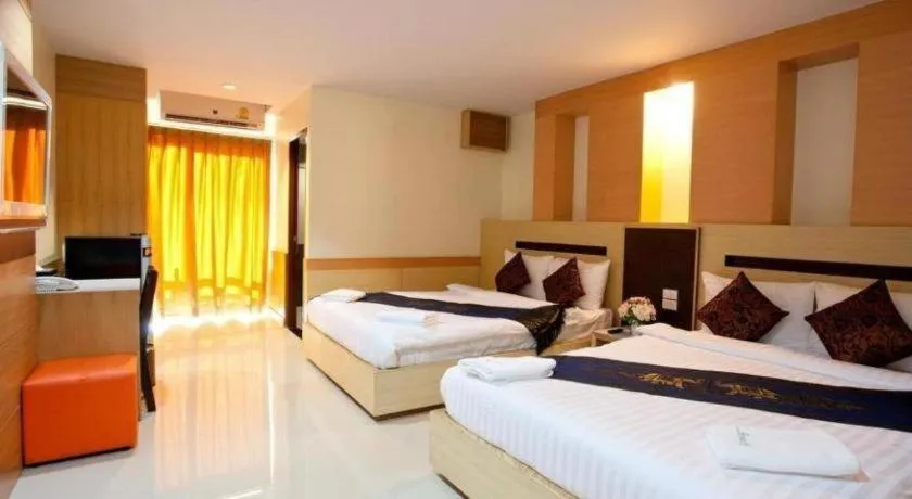 Bed in Amnauysuk Hotel