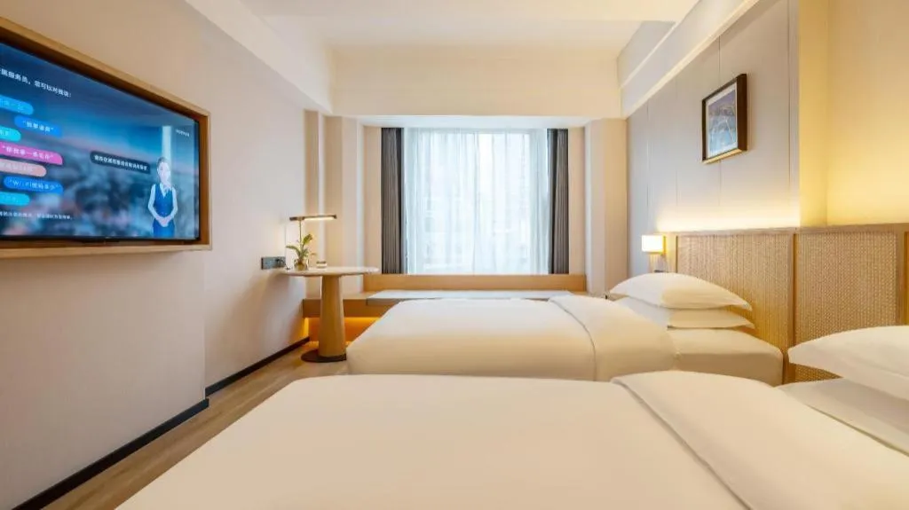 Bed in Gem Flower Jinyu Sunshine Hotel