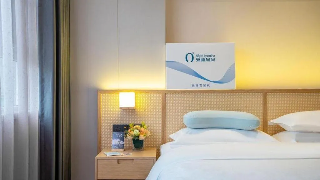 Bed in Gem Flower Jinyu Sunshine Hotel