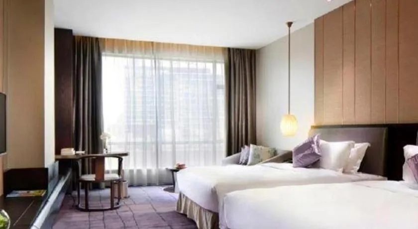 Bed in DongGuan JOYC Hotel 