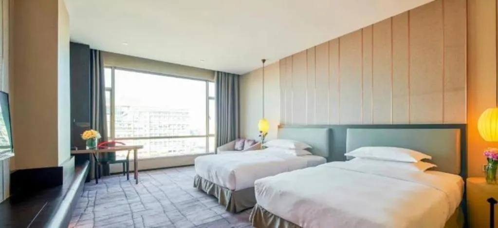 Bed in DongGuan JOYC Hotel 