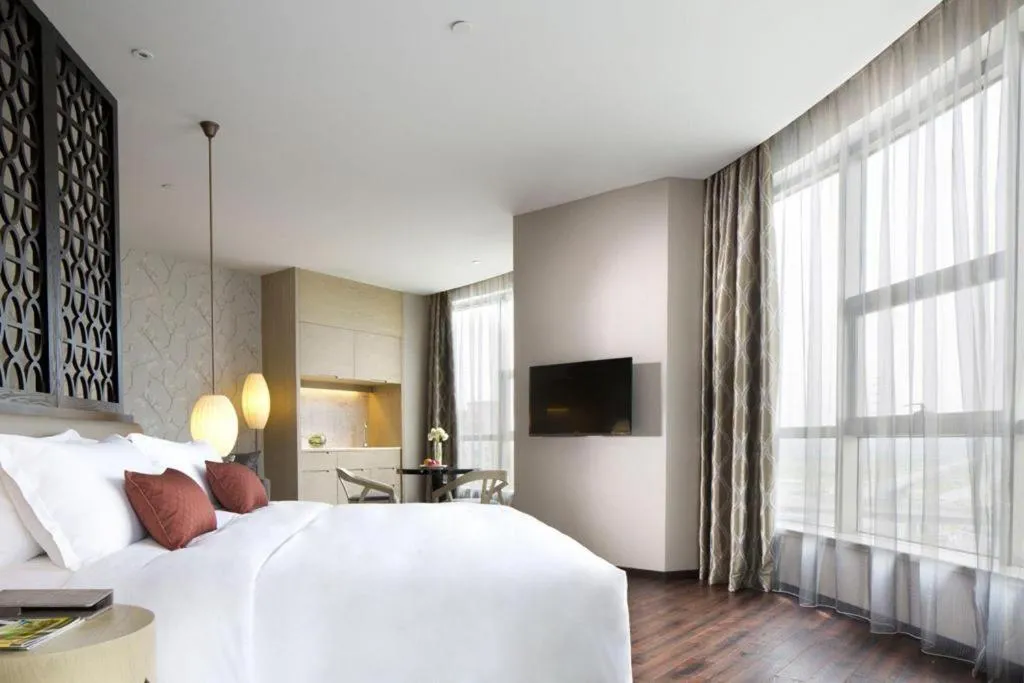 Bed in DongGuan JOYC Hotel 