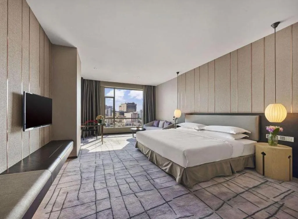 Bed in DongGuan JOYC Hotel 