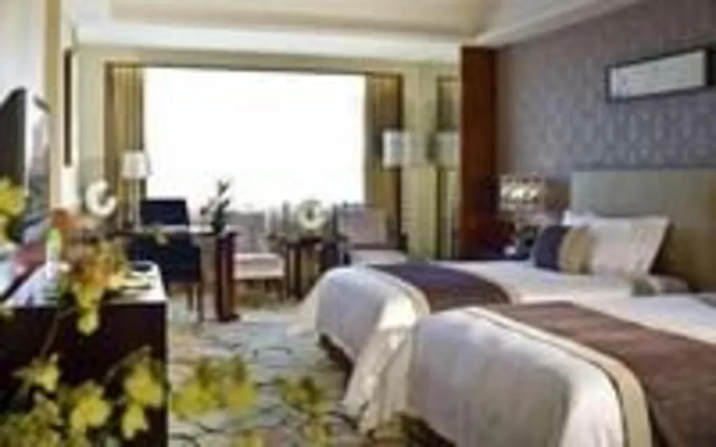 Bed in Eurasia International Hotel