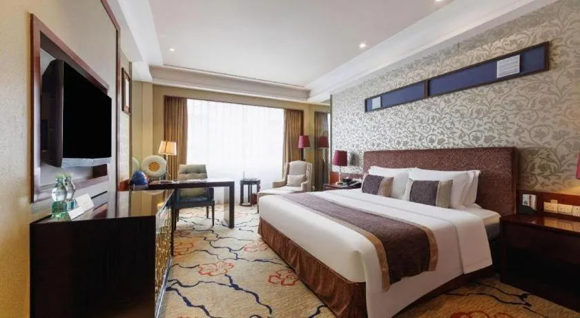 Bed in Eurasia International Hotel