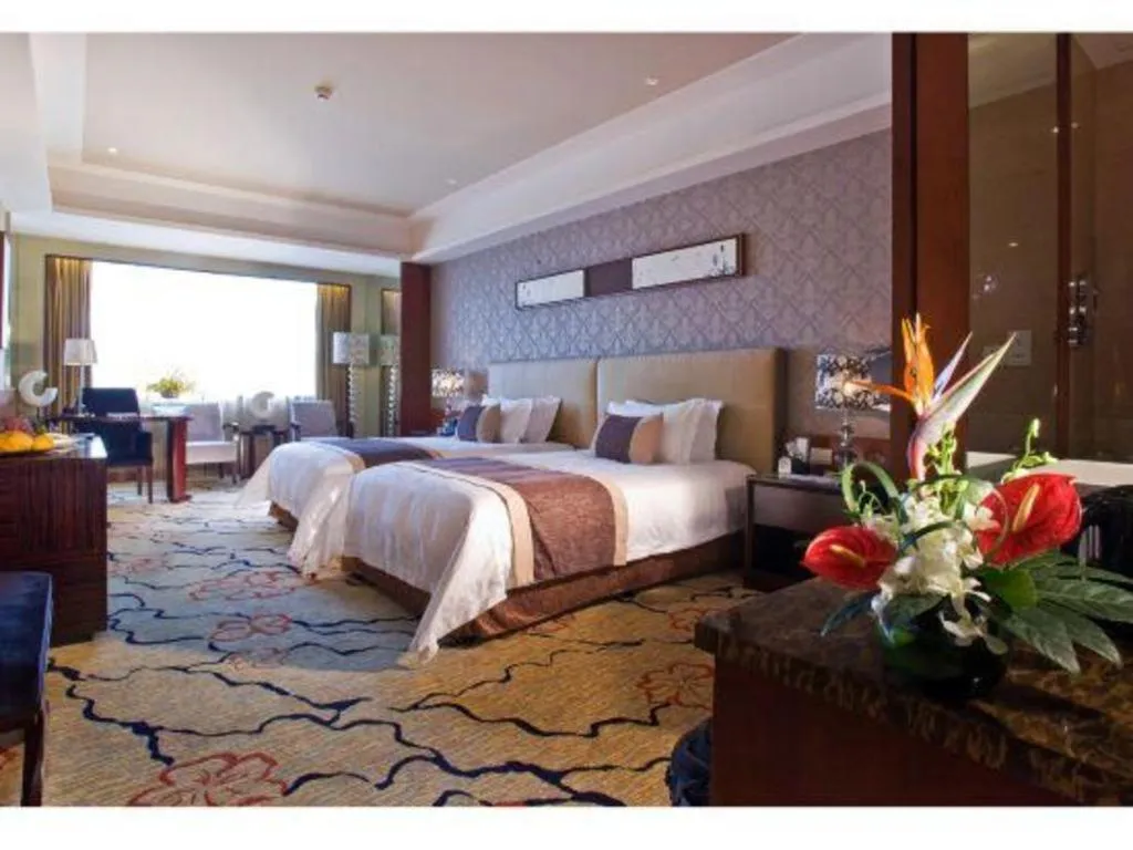 Bed in Eurasia International Hotel