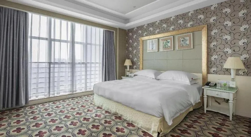 Bed in Eurasia International Hotel