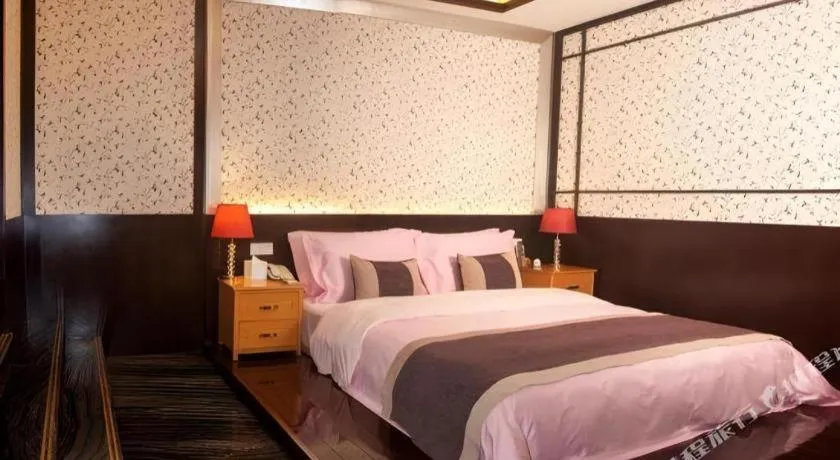 Bed in Eurasia International Hotel