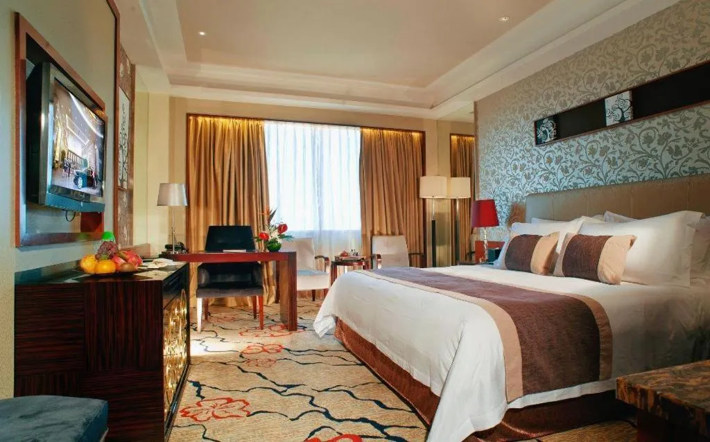 Bed in Eurasia International Hotel