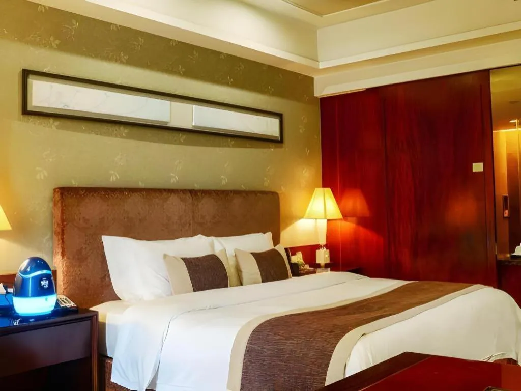 Bed in Eurasia International Hotel