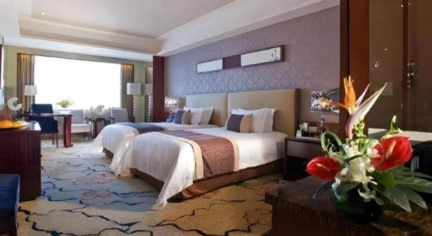 Bed in Eurasia International Hotel