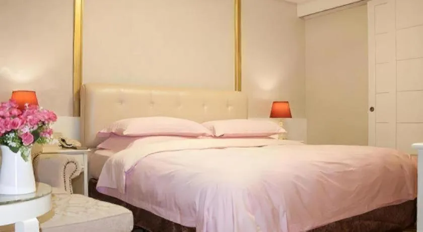 Bed in Eurasia International Hotel