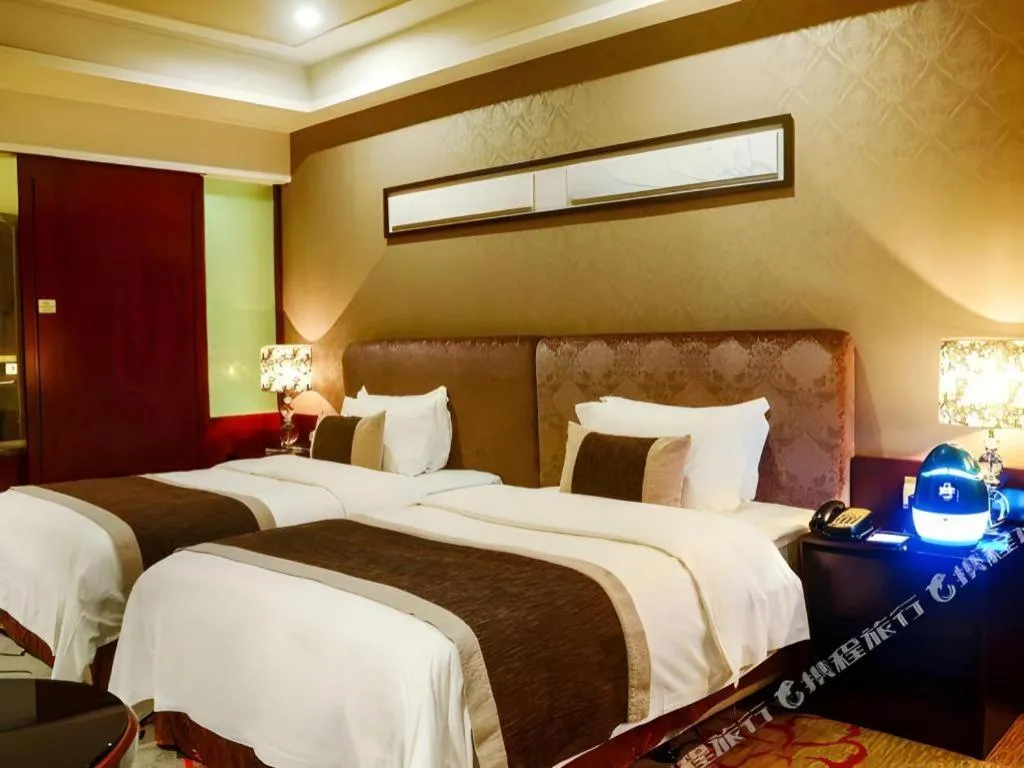 Bed in Eurasia International Hotel