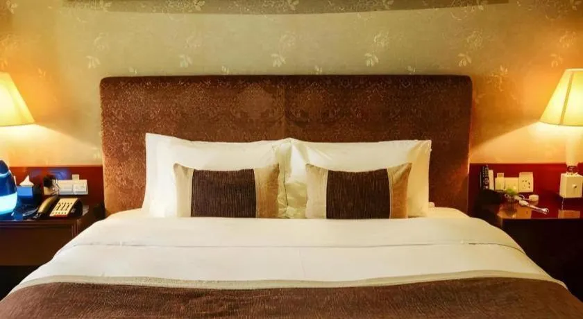 Bed in Eurasia International Hotel