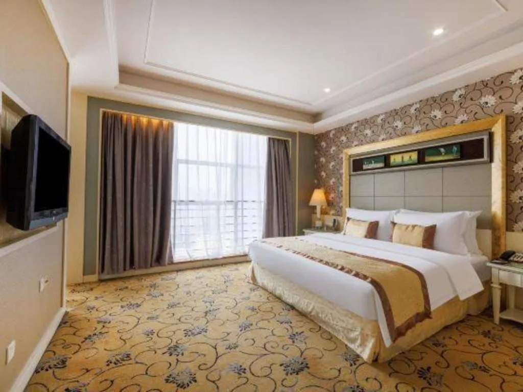 Bed in Eurasia International Hotel