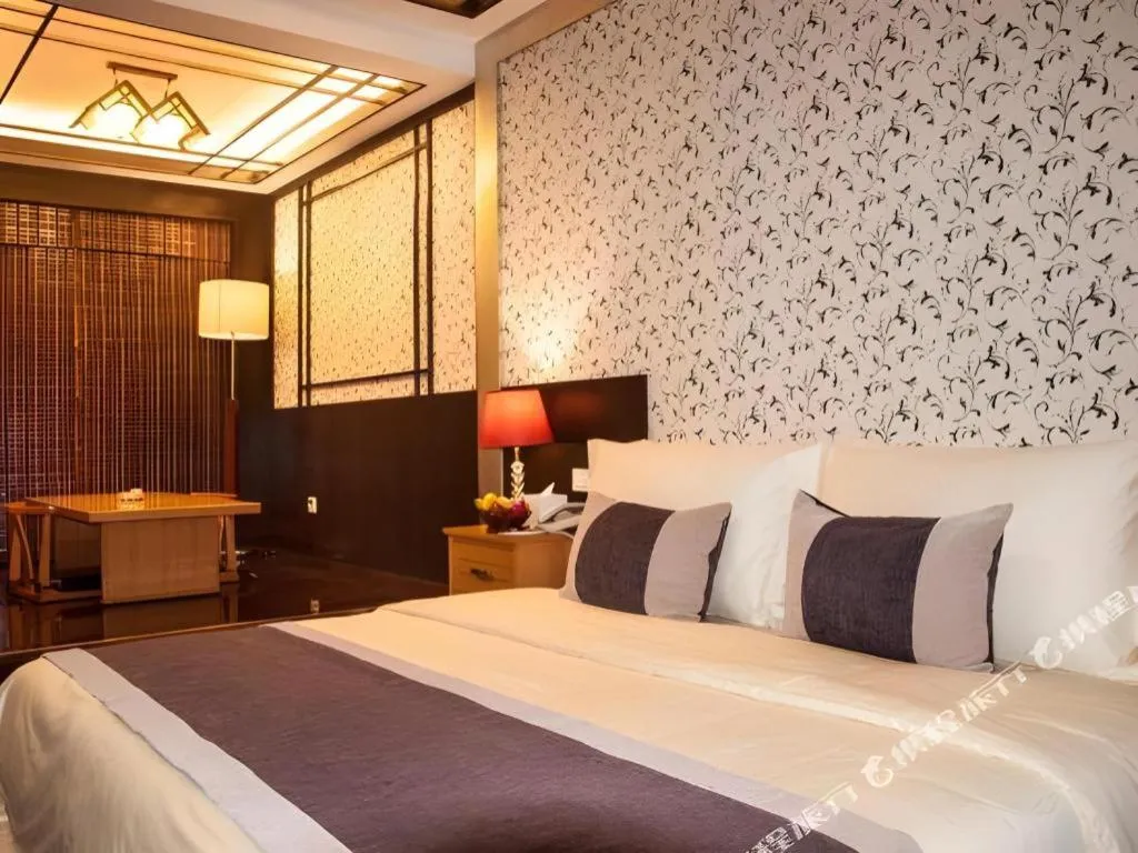 Bed in Eurasia International Hotel