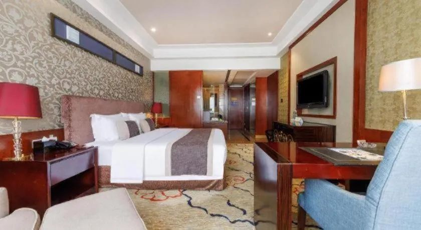 Bed in Eurasia International Hotel