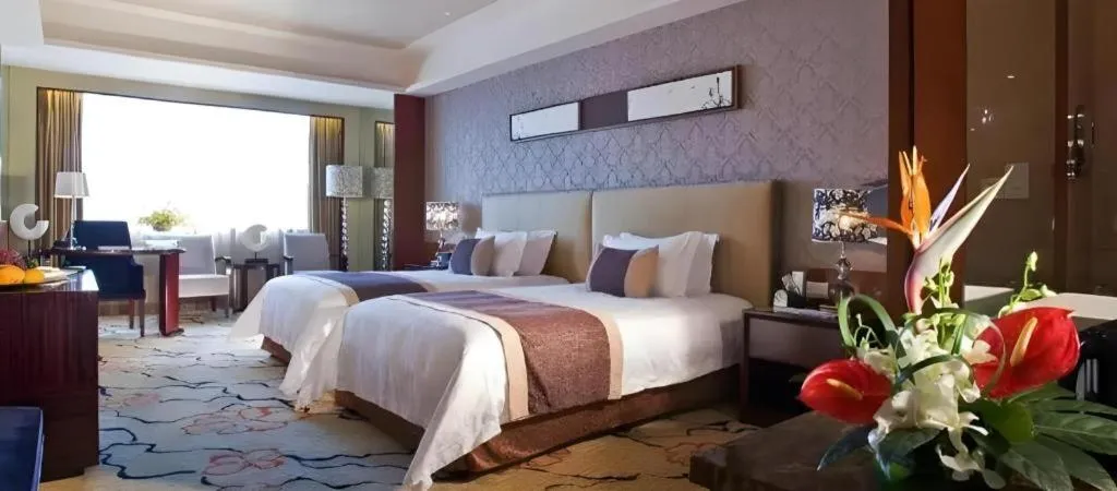 Bed in Eurasia International Hotel