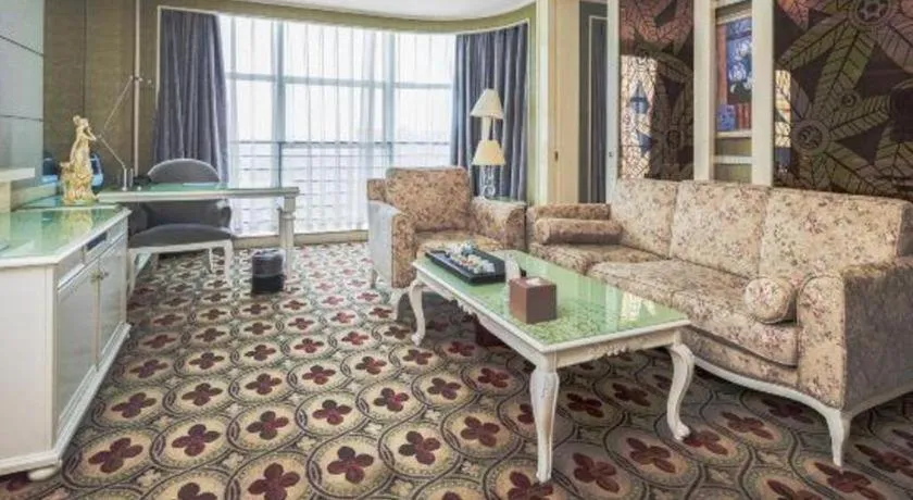 Bed in Eurasia International Hotel