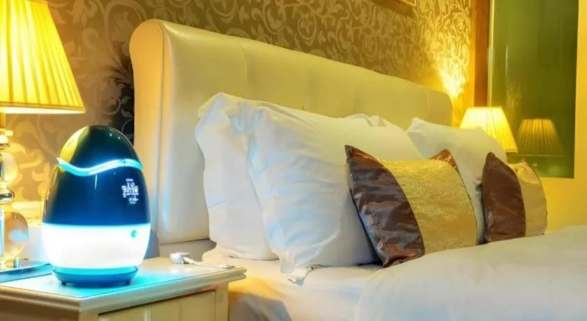 Bed in Eurasia International Hotel