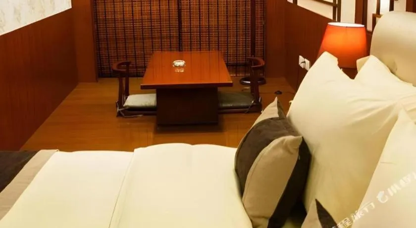 Bed in Eurasia International Hotel