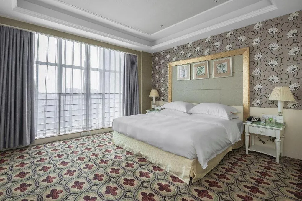 Bed in Eurasia International Hotel