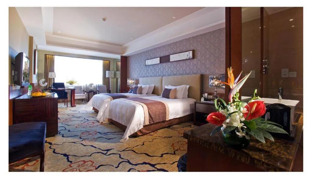 Bed in Eurasia International Hotel