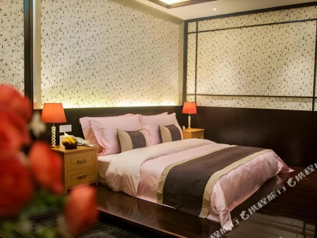 Bed in Eurasia International Hotel