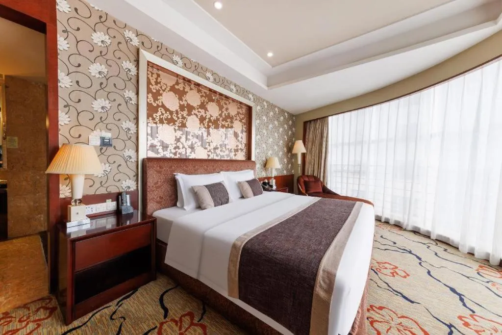 Bed in Eurasia International Hotel