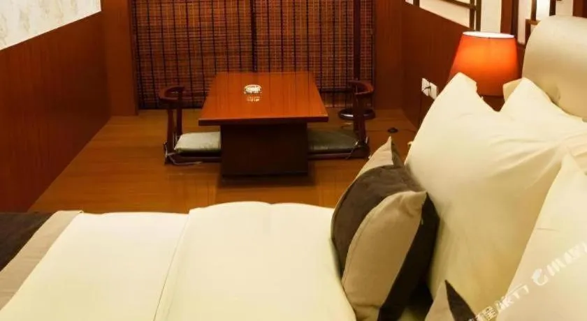 Bed in Eurasia International Hotel