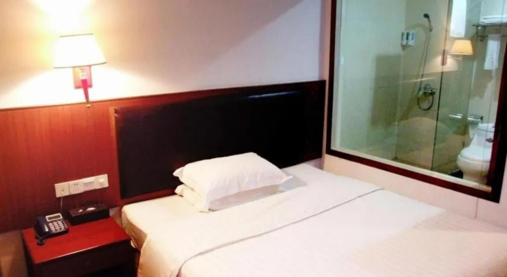 Bed in Eurasia International Hotel