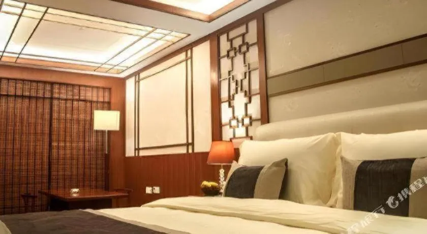 Bed in Eurasia International Hotel