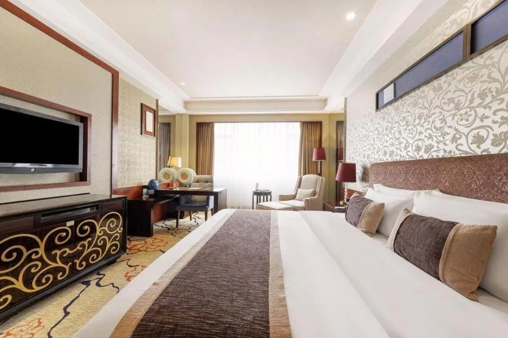 Bed in Eurasia International Hotel