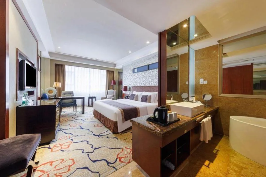 Bed in Eurasia International Hotel