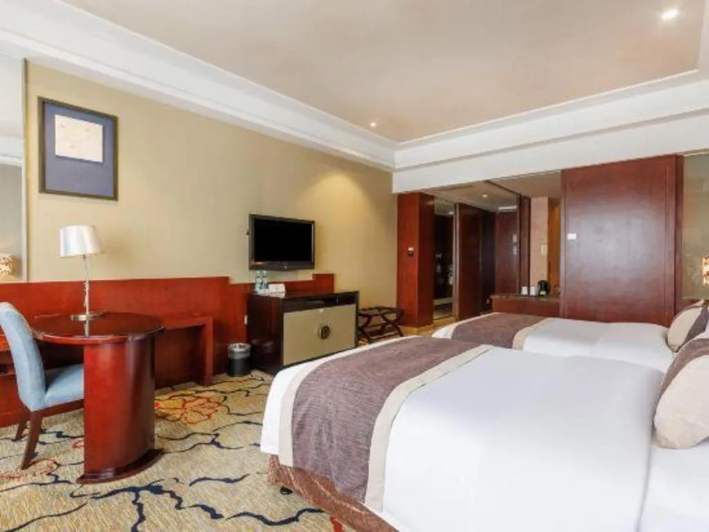 Bed in Eurasia International Hotel