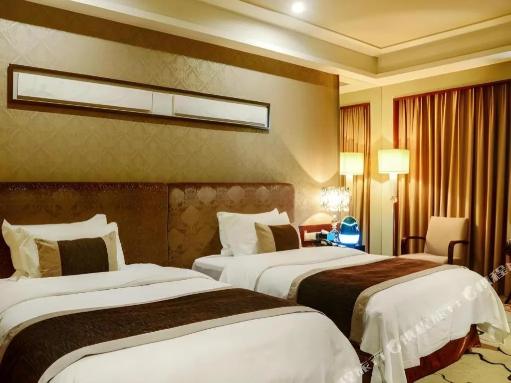 Bed in Eurasia International Hotel